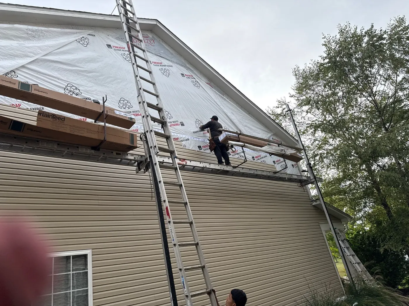 Siding installation documented in Asherwood